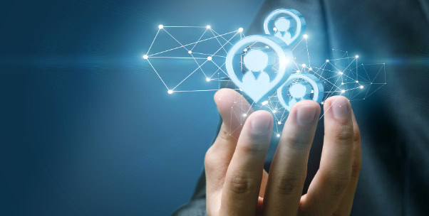 Hand holding connected lines and personal icons for research and analytics.